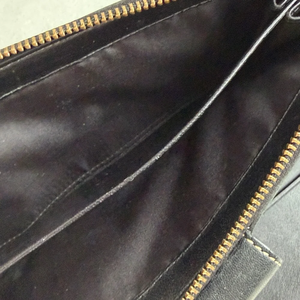 Coach Legacy Signature C jacquard and leather wallet.